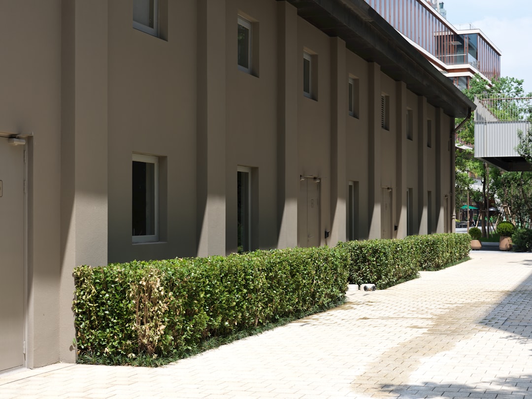 a-building-that-has-a-bunch-of-bushes-in-front-of-it-8a-slngg7mk