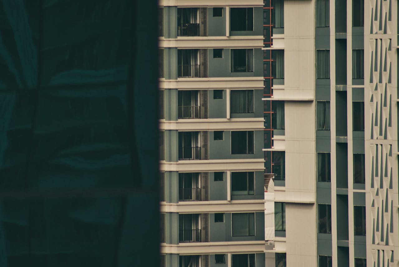 Close-up view of modern apartment buildings in an urban setting, highlighting architectural design.